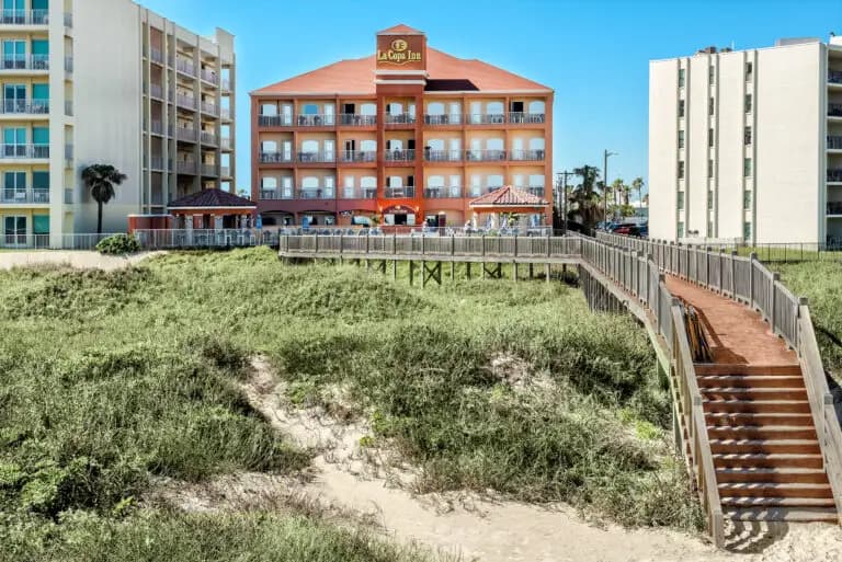 The boardwalk crossing the dunes from the hotel to the beach